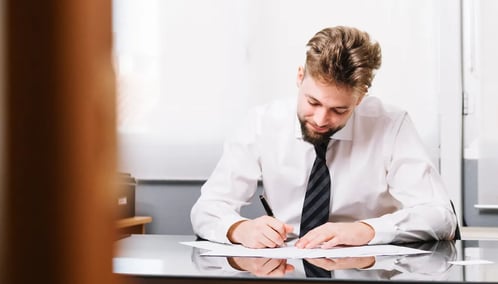 Employee Writing on a Document