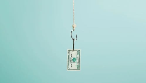 A hook suspends a dollar bill, symbolizing financial opportunity or temptation