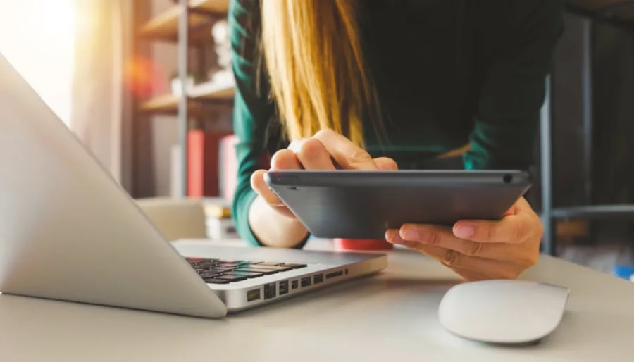 Businesswoman hand using tablet