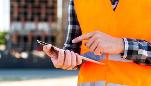 Close-up of construction engineer using tablet
