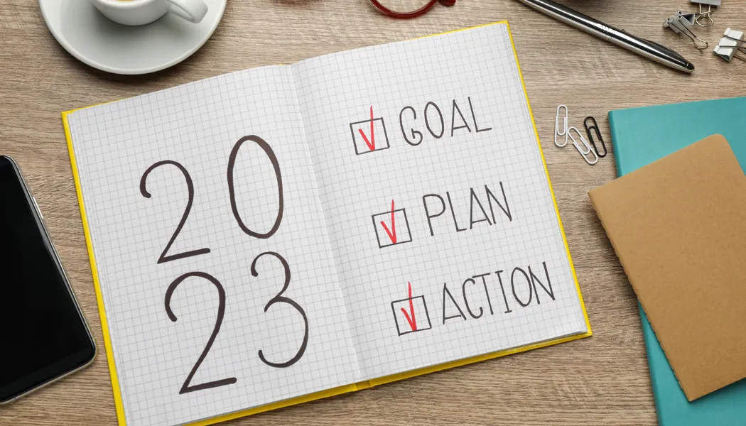 Checklist with goal, plan, and action written on a 2023 planning diary.