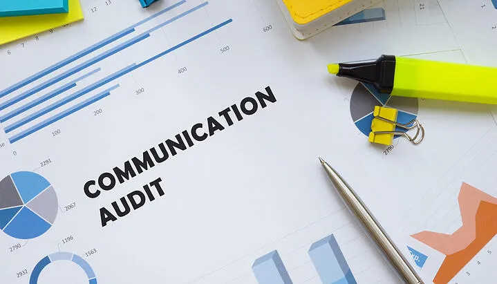 Internal communication audit written on a planner at office desk. (1)