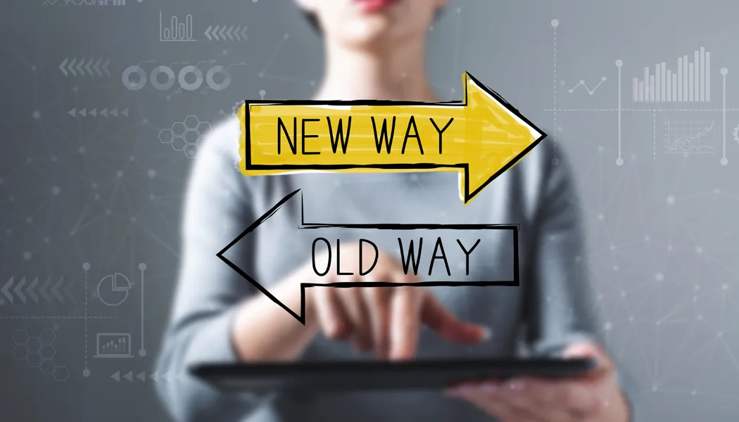 Woman holding digital screen with “new way” highlighted in yellow